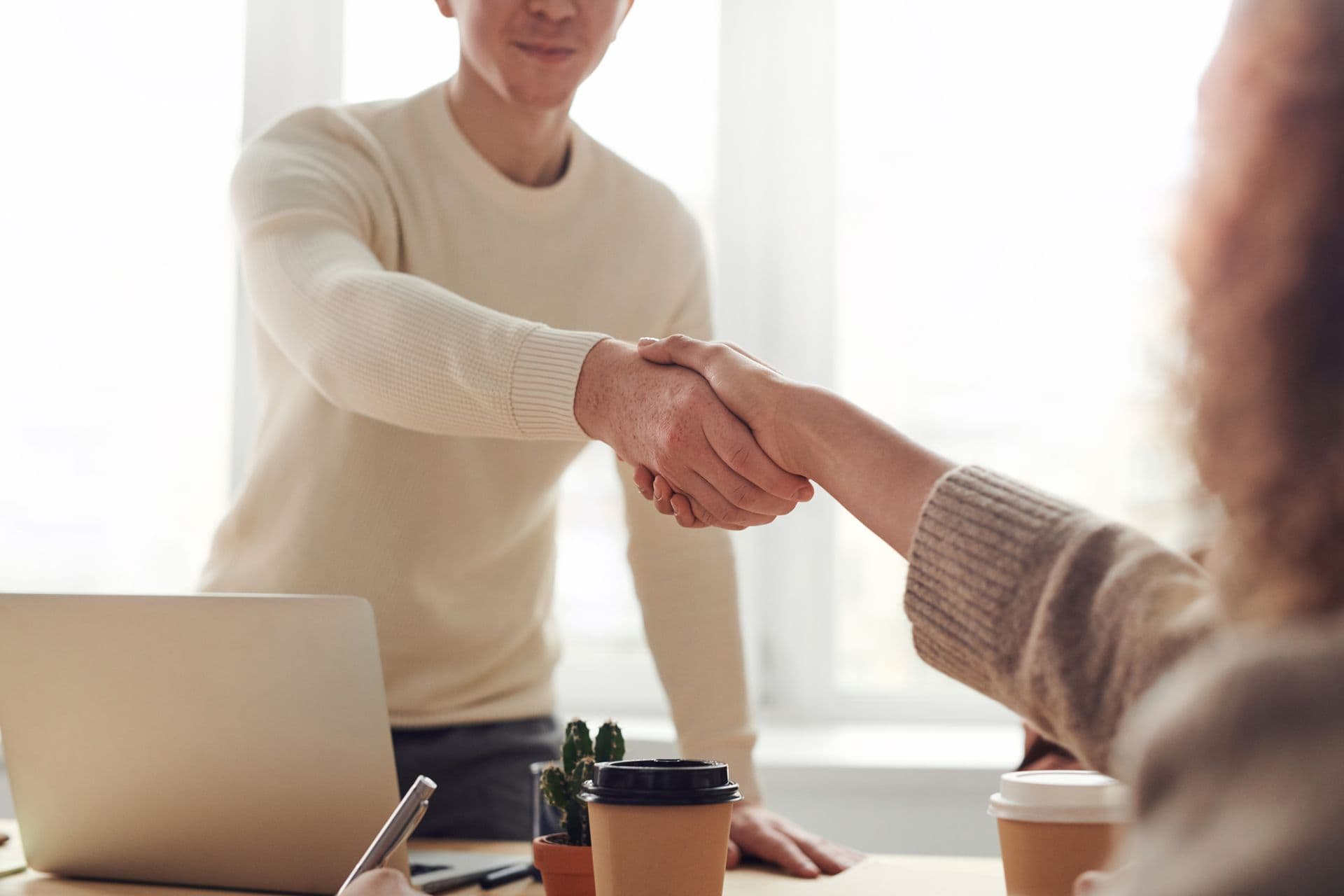 Recruiter and candidate shaking hands after an interview